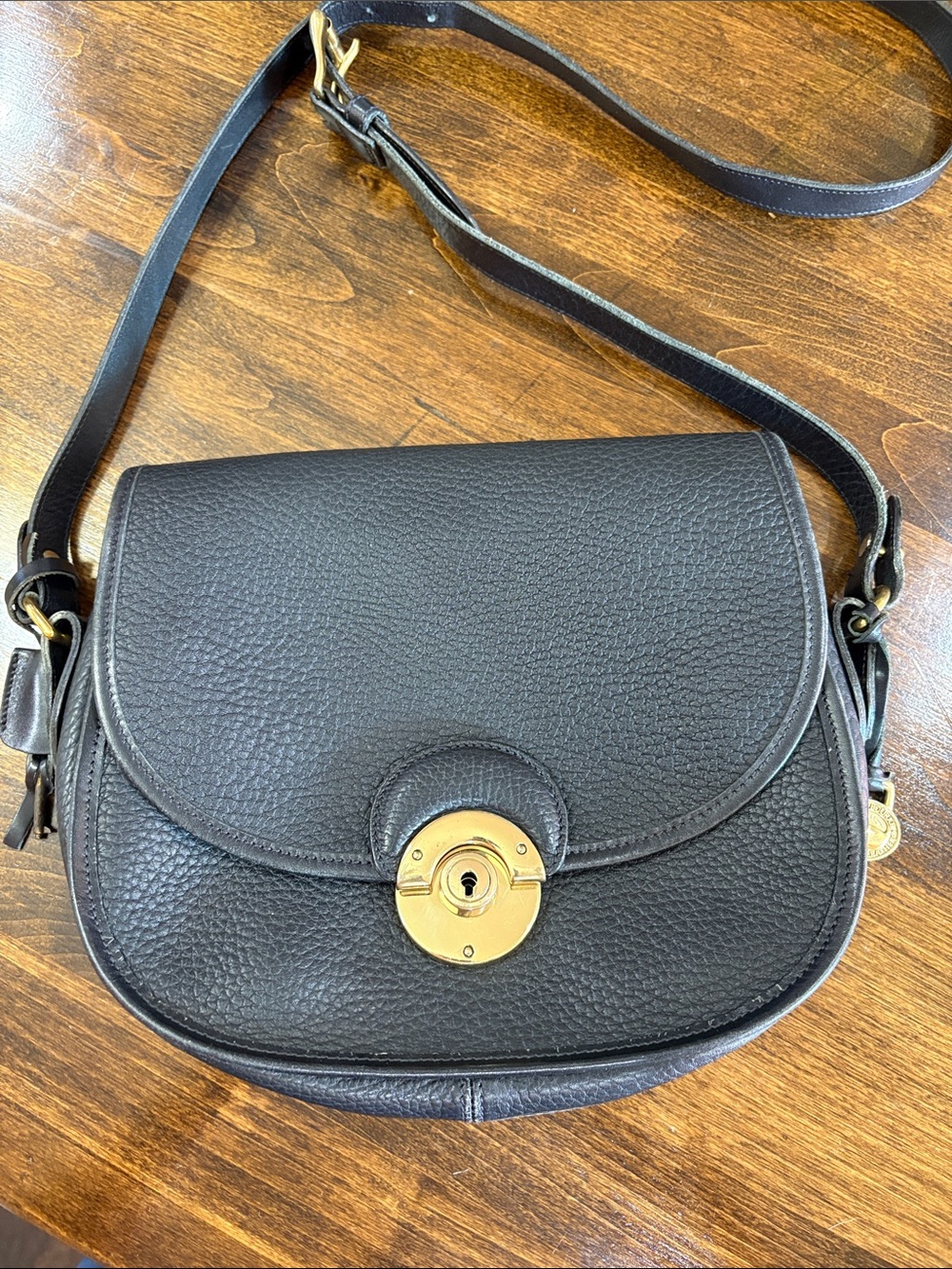 Dooney and Bourke VINTAGE Black Leather Crossbody Saddle Bag with Gold-Tone Lock